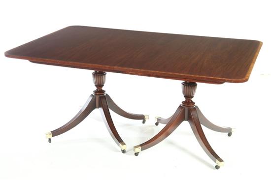 Appraisal: NEOCLASSICAL DINING TABLE Baker Furniture th century mahogany Two pedestals