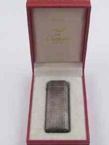 Appraisal: A silver plated Cartier Paris cigarette lighter numbered in original