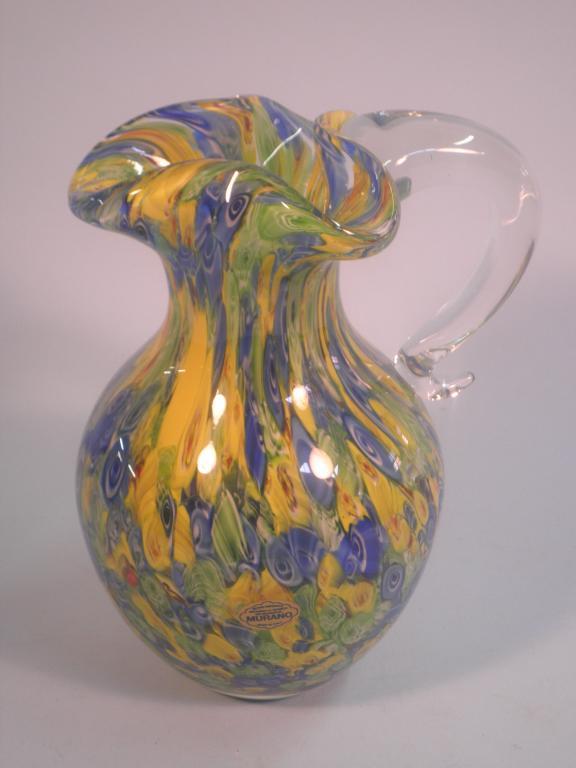 Appraisal: A Murano glass jug with millefiori type decoration in red