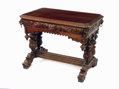 Appraisal: A Victorian carved oak side table decorated foliage and masks