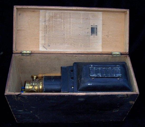 Appraisal: A cased Optimus magic lantern by Perken Son Co Ltd