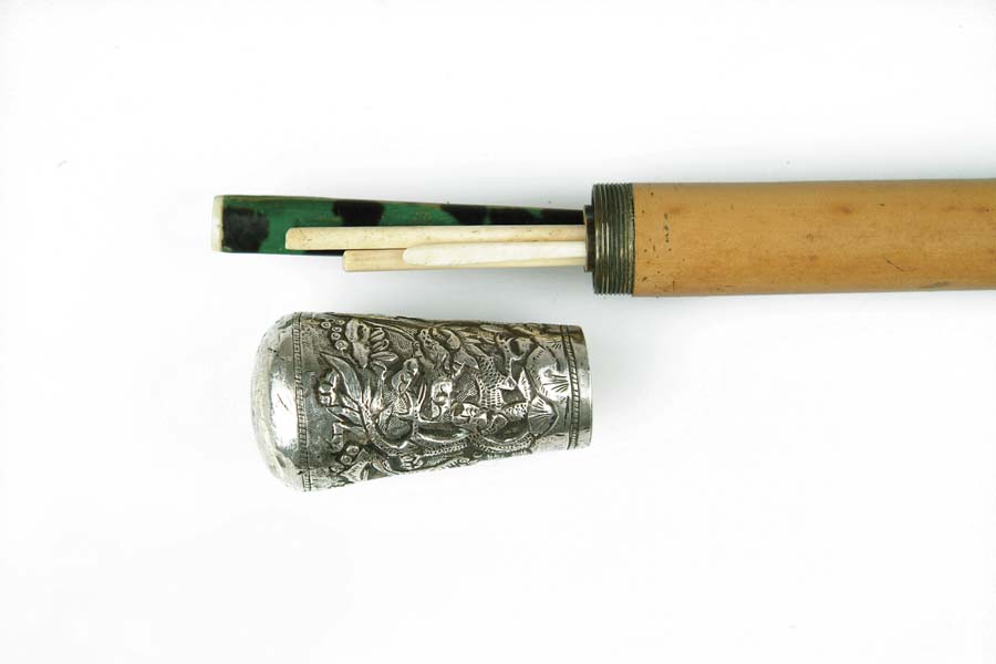 Appraisal: PICNIC CANE Repousse silver handle Oriental theme with people houses