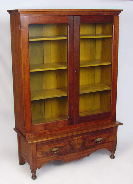 Appraisal: AMERICAN COUNTRY BOOKCASE CHINA HUTCH ON STAND Glass door case