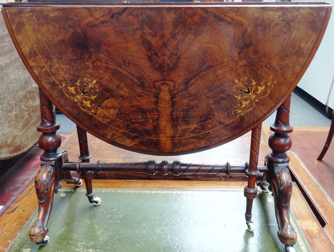 Appraisal: A Victorian marquetry inlaid figured walnut Sutherland table the oval