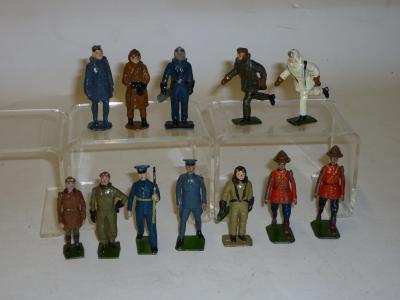 Appraisal: Twelve metal figures comprising two Britains RCMP four Britains RAF