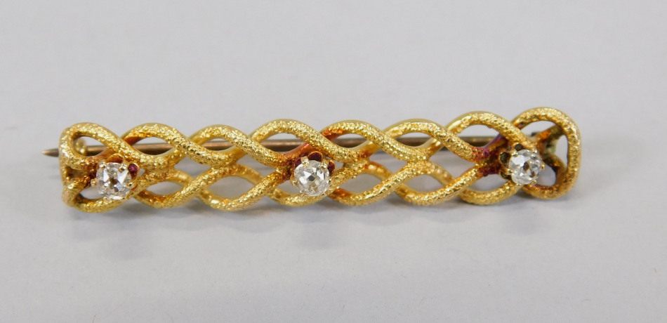 Appraisal: A bar brooch with rope twist design set with tiny