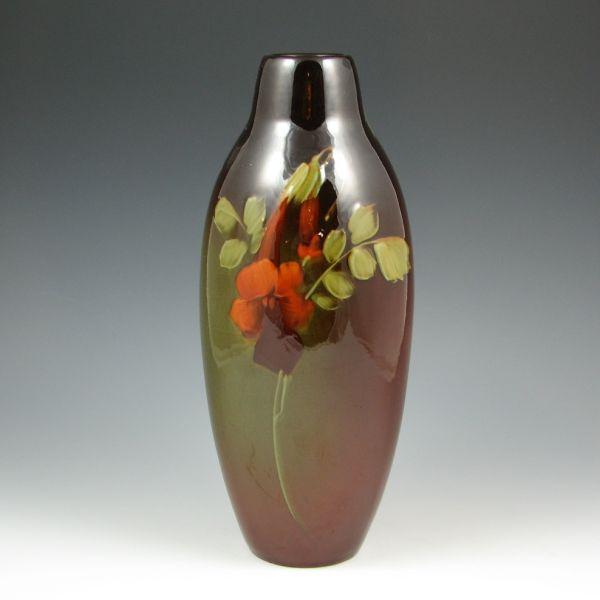 Appraisal: Weller Louwelsa standard glaze vase with slip-decorated floral design Marked