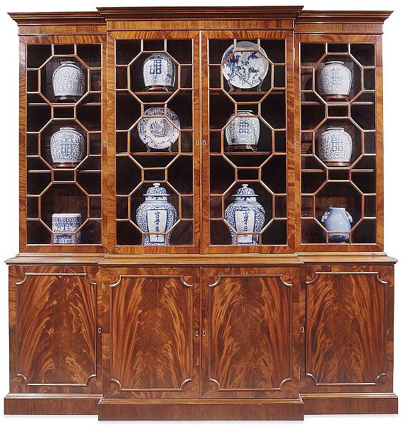 Appraisal: An imposing George III style mahogany breakfront bookcase The upper