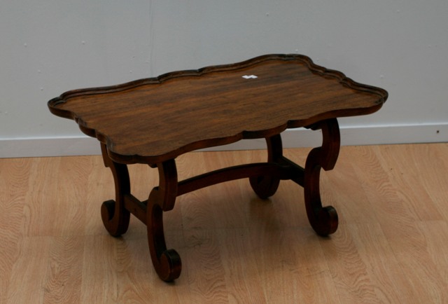 Appraisal: A carved wood coffee table