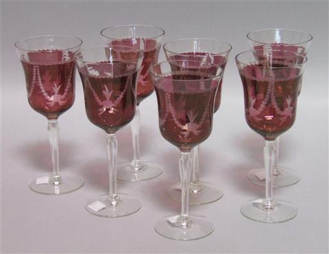 Appraisal: SEVEN CRANBERRY GLASS GOBLETS Each delicate stem with a garland