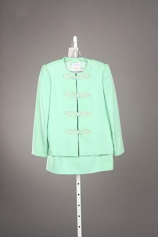 Appraisal: Andr Laug green silk skirt suit with applique clasps Approx