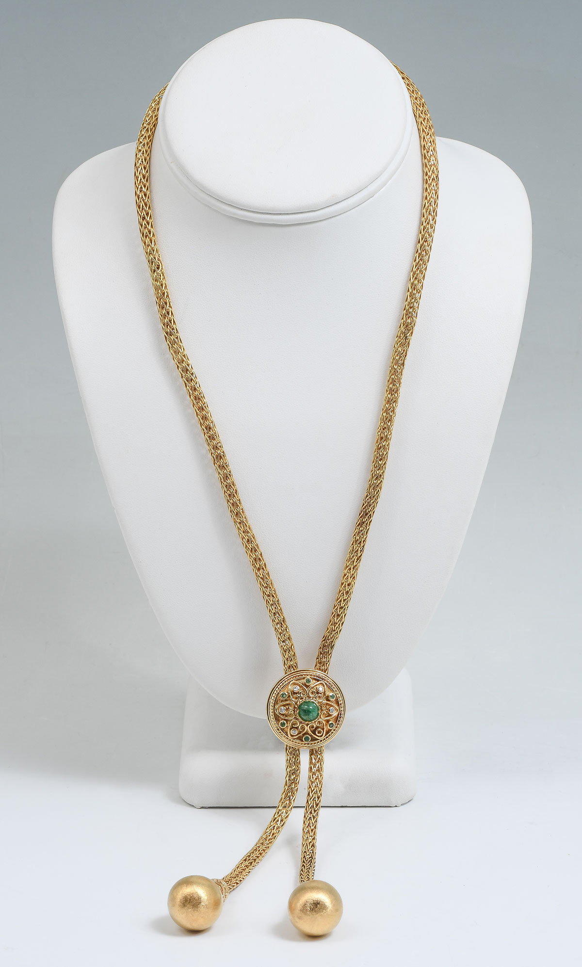 Appraisal: K TASSEL STYLE NECKLACE WITH EMERALDS DIAMONDS K yellow gold