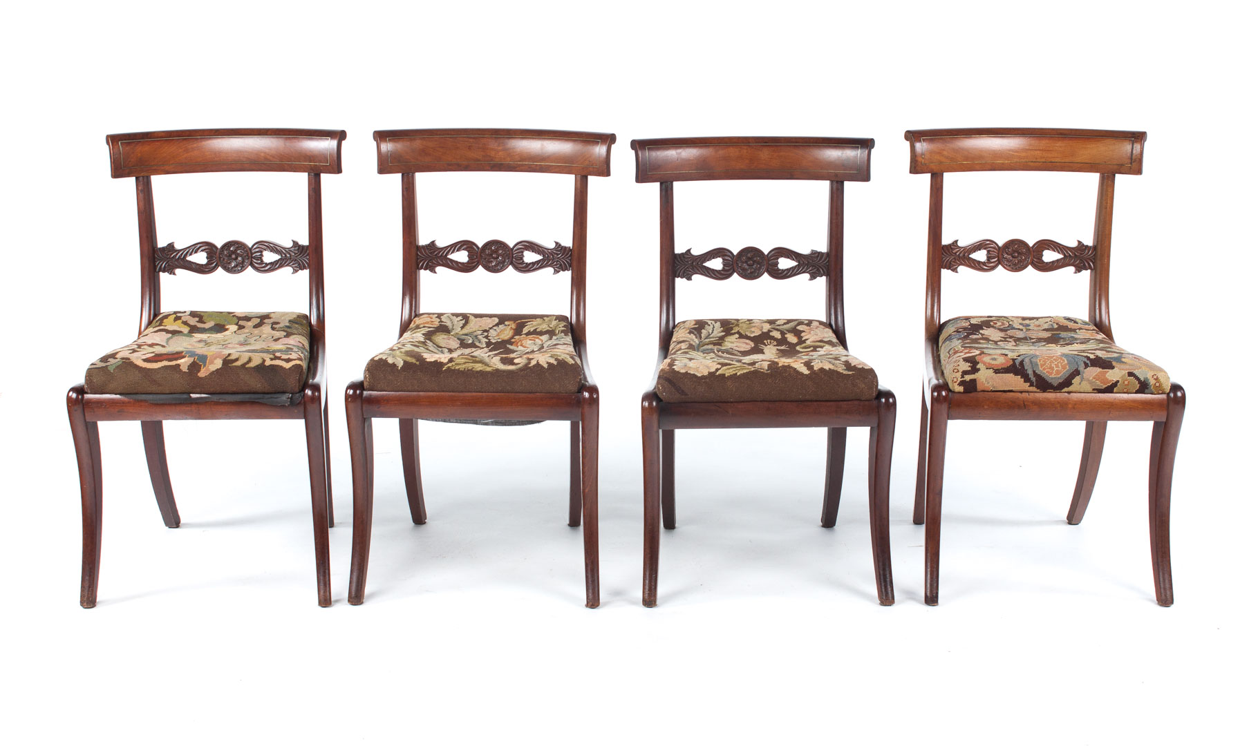 Appraisal: Four Regency carved mahogany side chairs circa Klismos form brass