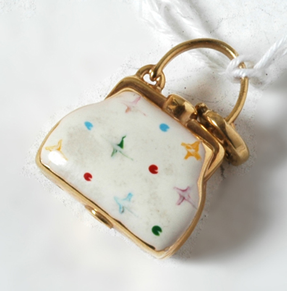 Appraisal: CT GOLD AND WHITE ENAMEL HANDBAG CHARM