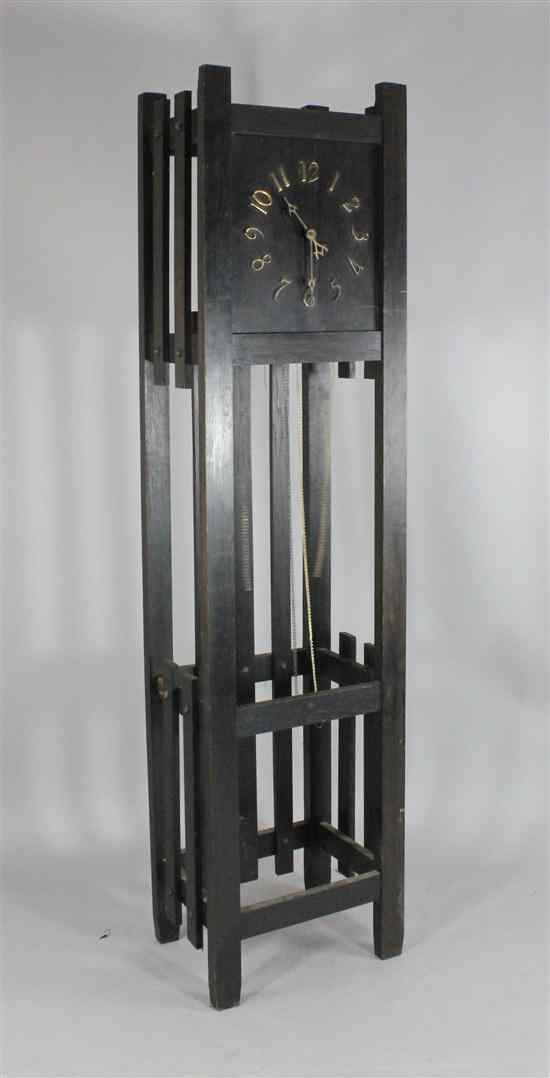 Appraisal: An Arts Crafts ebonised oak thirty hour longcase clock with