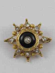 Appraisal: A yellow metal tests ct gold onyx and diamond star