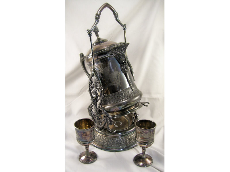 Appraisal: Victorian Silverplate Tilting Water Pitcher Silverplated water pitcher on tilting