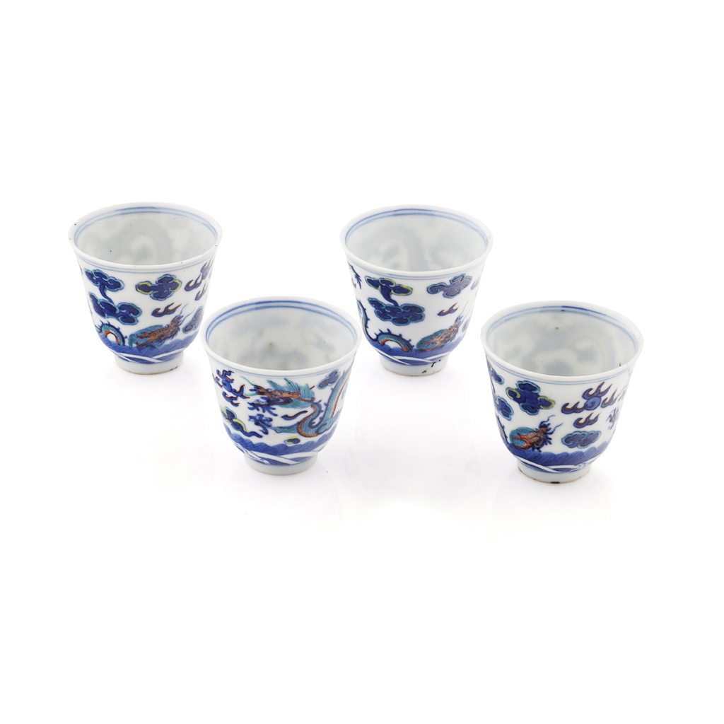 Appraisal: FOUR DOUCAI 'DRAGON' TEA BOWLS QIANLONG FOUR CHARACTER MARK BUT