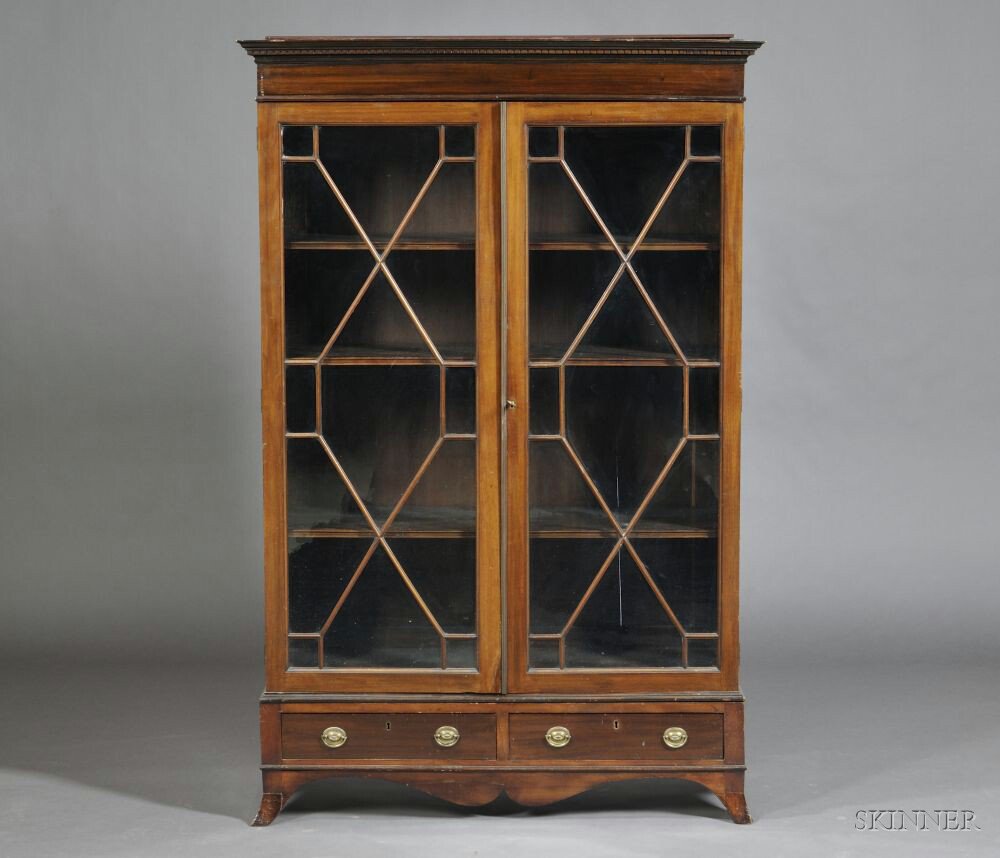 Appraisal: Edwardian Mahogany Two-door Bookcase the stepped cornice with a dentil