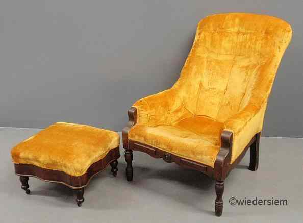 Appraisal: Mahogany lolling chair th c and stool Chair ''h x