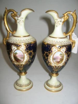 Appraisal: A PAIR OF COALPORT CHINA EWERS with high acanthus sheathed