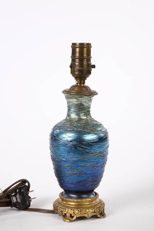 Appraisal: ART GLASS BOUDOIR LAMP Attributed to Durand Blue iridescent glass