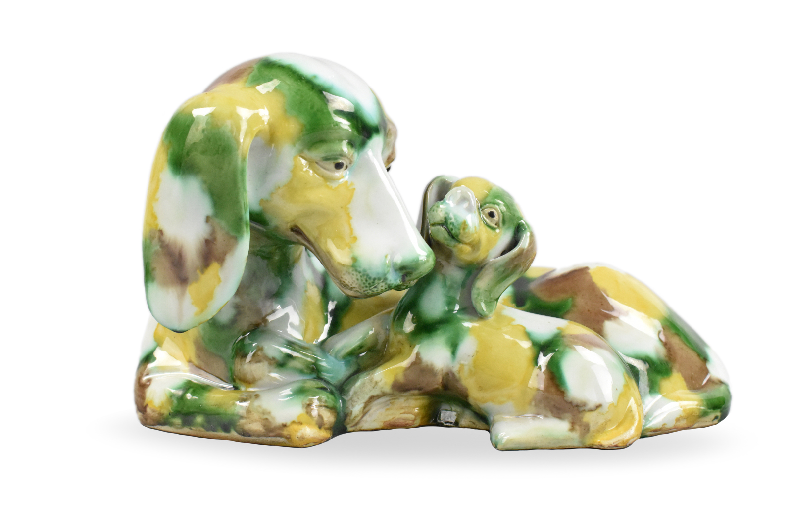 Appraisal: A Chinese sancai glazed dog with a puppy figure dating