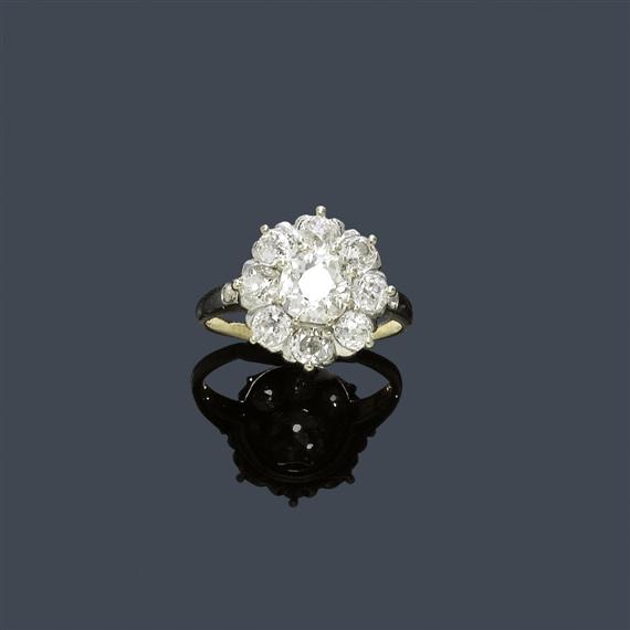 Appraisal: A DIAMOND RING Platinum on yellow gold Decorative ring the