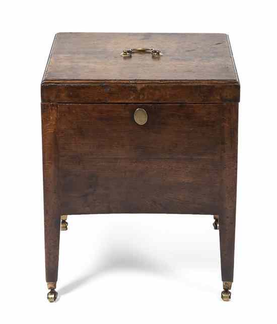 Appraisal: A Georgian Oak Cellarette having a rectangular hinged top with