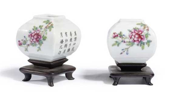 Appraisal: A SMALL PAIR OF FAMILLE ROSE SQUARE VASES DECORATED WITH