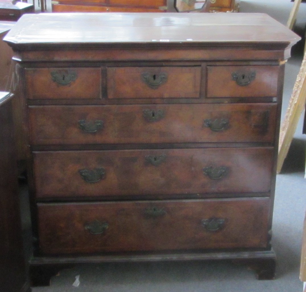 Appraisal: An early th century crossbanded figured walnut chest of three