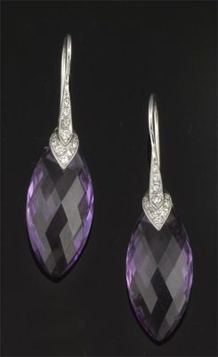 Appraisal: A pair of faceted marquise shaped amethyst and diamond set