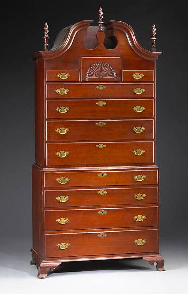 Appraisal: A Chippendale carved cherry chest on chest In two parts