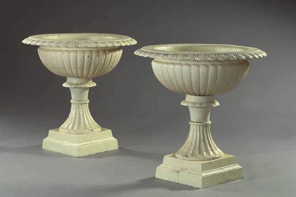 Appraisal: Large Pair of Cast-Iron Three-Part Garden Urns the reeded bowls