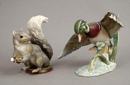 Appraisal: Contemporary Polychrome Porcelain Figures of a Squirrel and a Wood