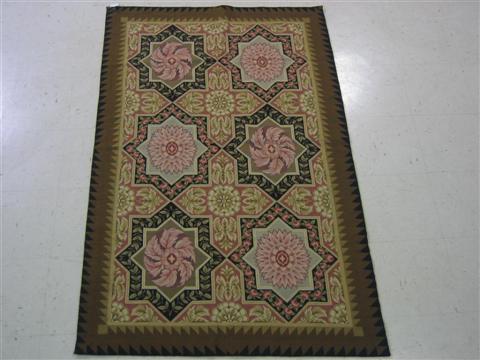 Appraisal: MODERN NEEEDLEPOINT RUG Sewn with flowers in star-shaped panels within