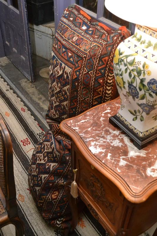 Appraisal: A LARGE PERSIAN SITTING CUSHION IN TRIBAL EMBROIDERED PATTERNS A