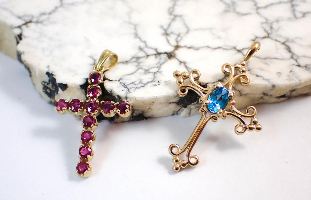 Appraisal: TWO FOURTEEN KARAT YELLOW GOLD CROSS PENDANTS including a cross