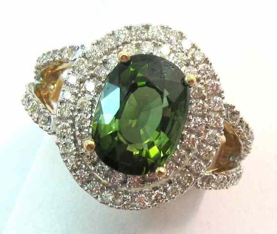 Appraisal: GREEN TOURMALINE AND DIAMOND RING k yellow gold centering an