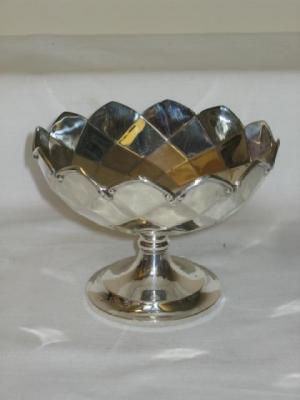 Appraisal: A BONBON STAND of circular form with moulded and scrolled