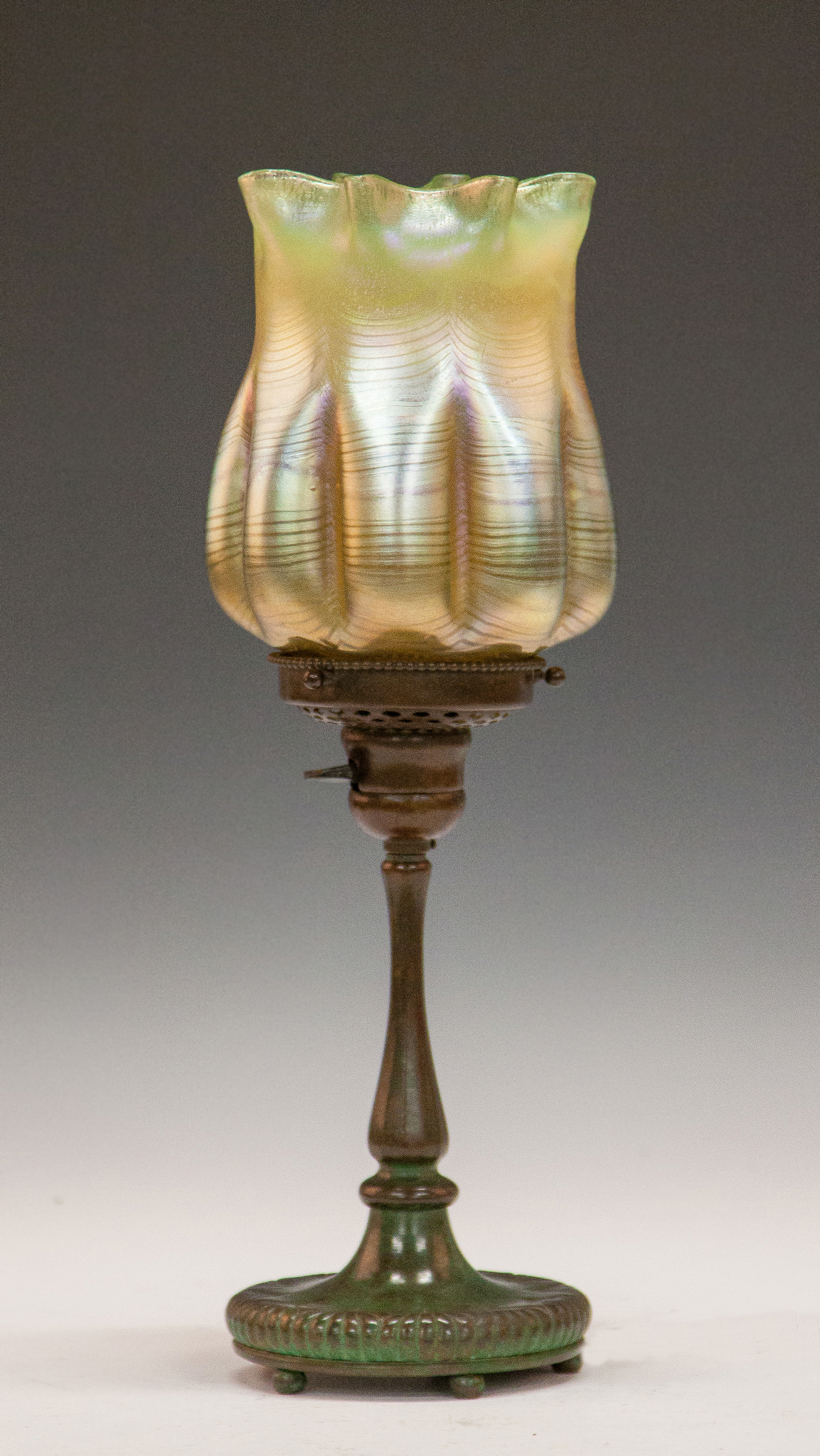 Appraisal: Tiffany Studios Table Lamp Iridescent shade with feather decoration ruffled