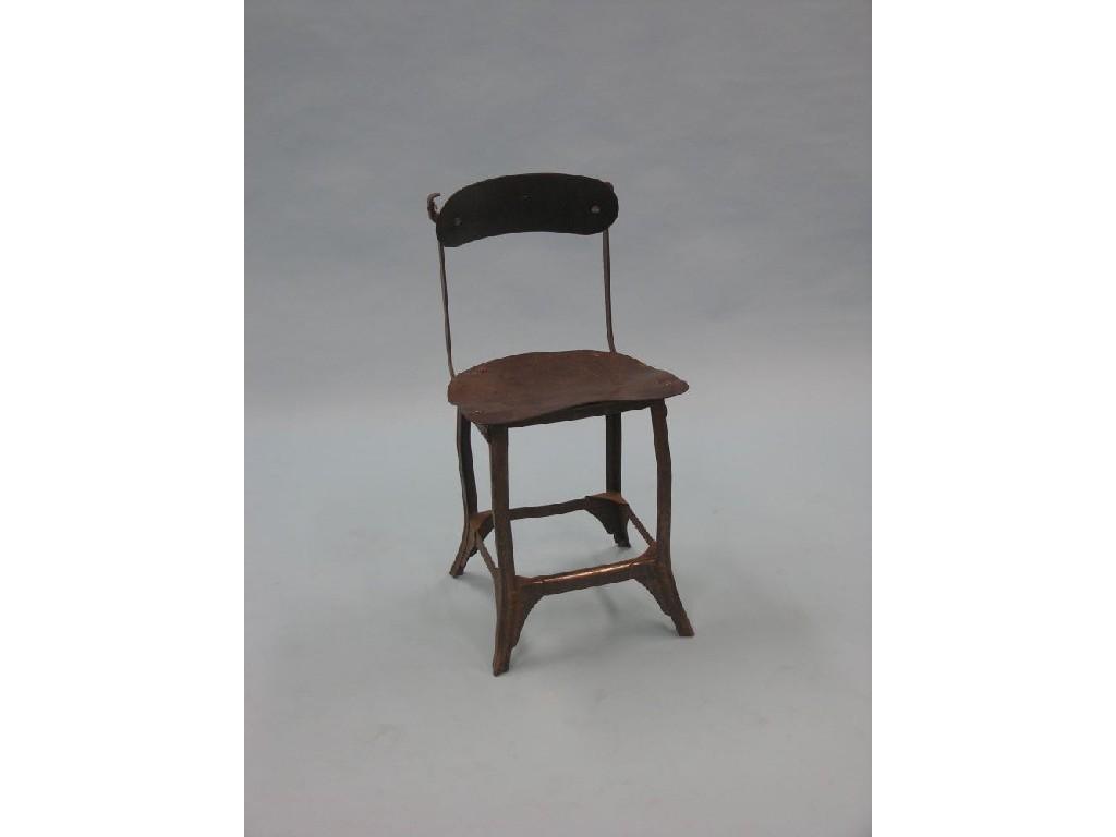 Appraisal: A WWII military campaign chair sheet-iron construction with leatherette-covered seat