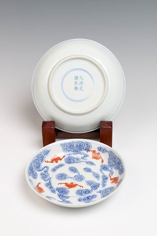 Appraisal: PAIR OF BLUE WHITE AND IRON RED BAT DISHES GUANGXU