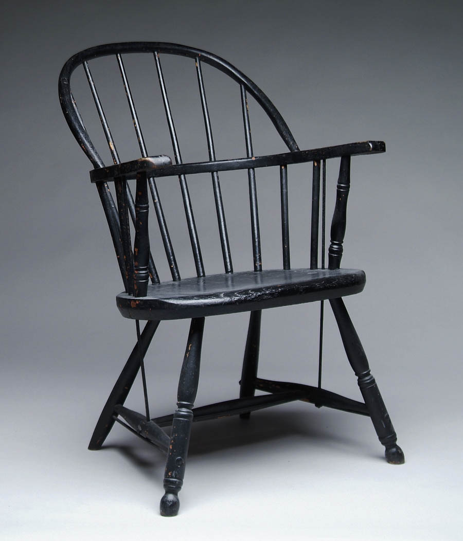 Appraisal: WINDSOR ARMCHAIR IN BLACK PAINT Six spindle back splayed legs