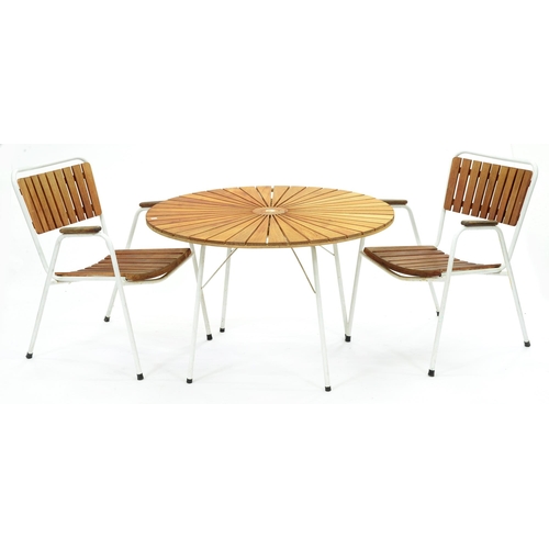 Appraisal: A teak and white painted tubular metal garden table and