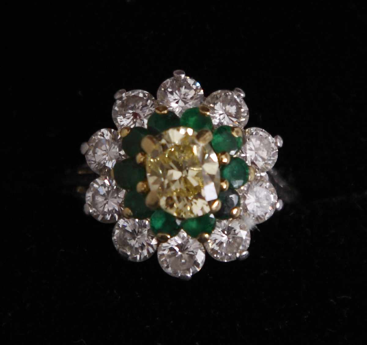 Appraisal: Yellow Diamond Emerald Ring set in Platinum Yellow diamond surrounded