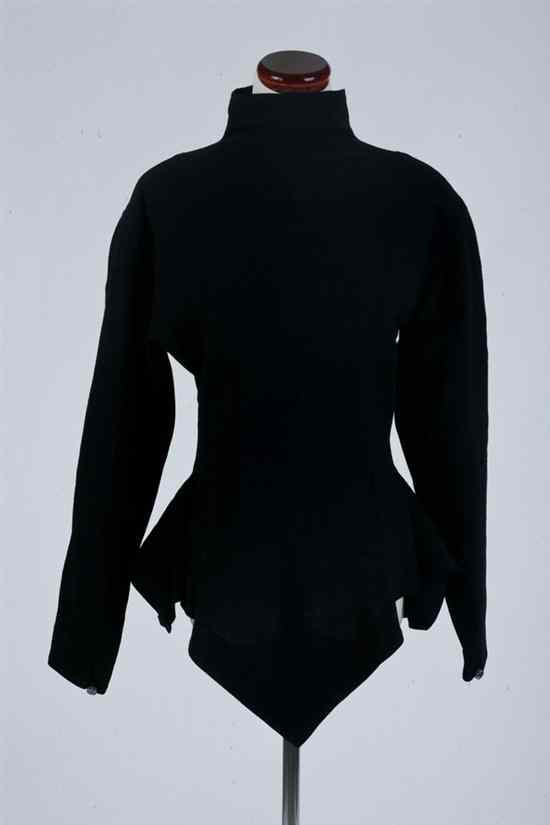 Appraisal: GARFINCKEL'S BLACK AVANT GARDE BLOUSE Mock turtleneck darted and flared