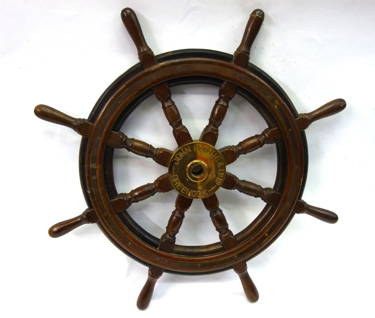 Appraisal: A brass mounted hardwood ship's wheel inscribed 'John Hastie Co