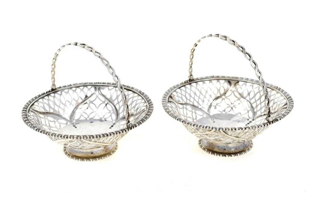 Appraisal: A PAIR OF GEORGE III BASKETS pierced and embossed with