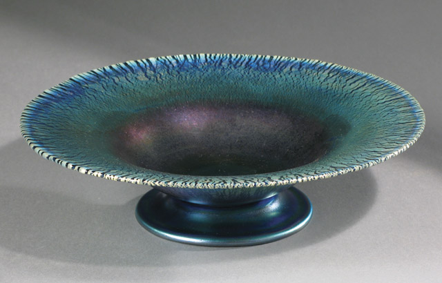 Appraisal: L C TIFFANY FAVRILE PEDESTAL BOWL purple iridescent and peacock